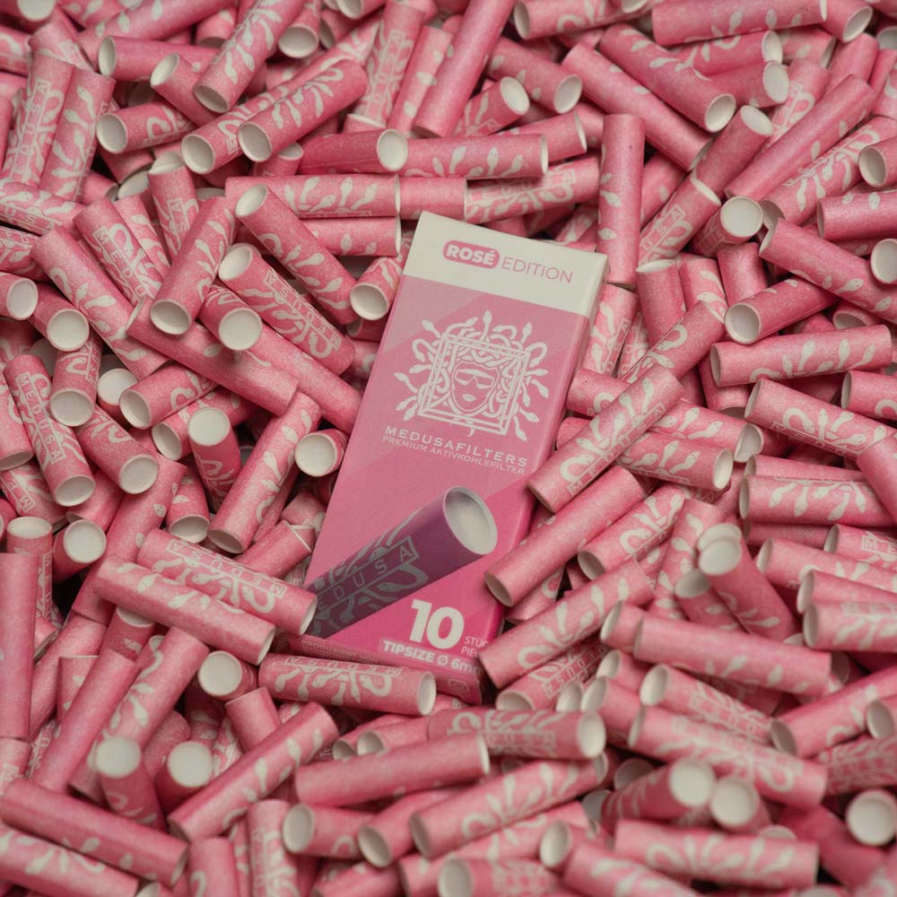 10er-Schachtel ROSÉ auf einem Haufen Medusafilters Aktivkohlefilter