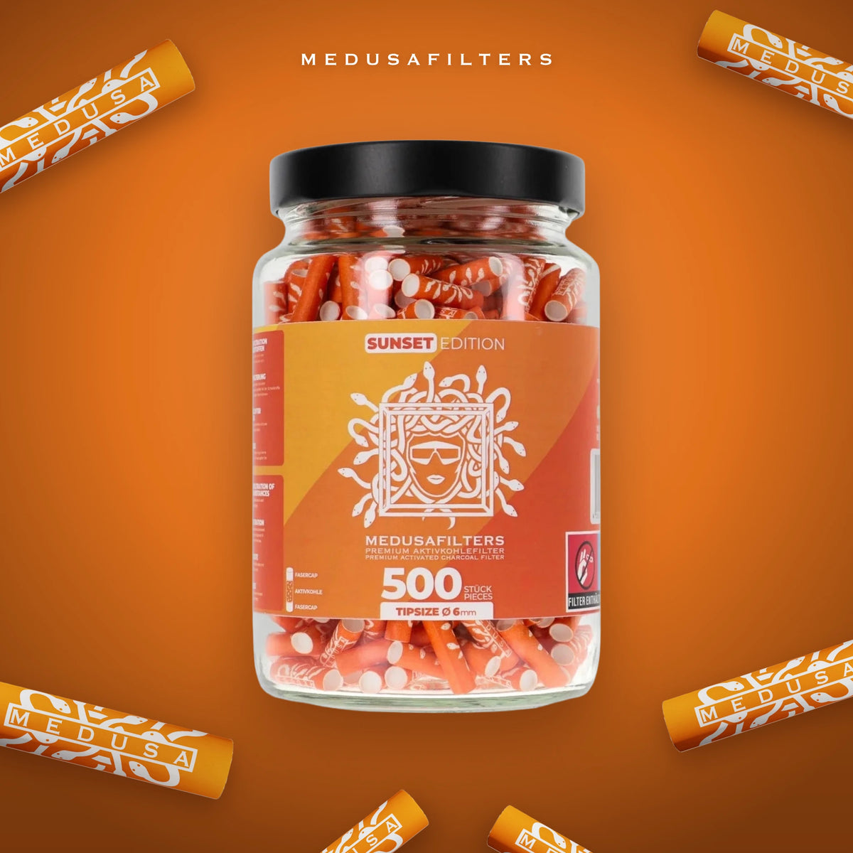 500er-Glas SUNSET mit verstreuten Medusafilters Aktivkohlefiltern